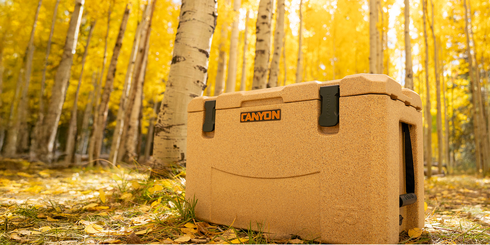 Outfitter 55 V2 in Sandstone in front of golden aspen trees