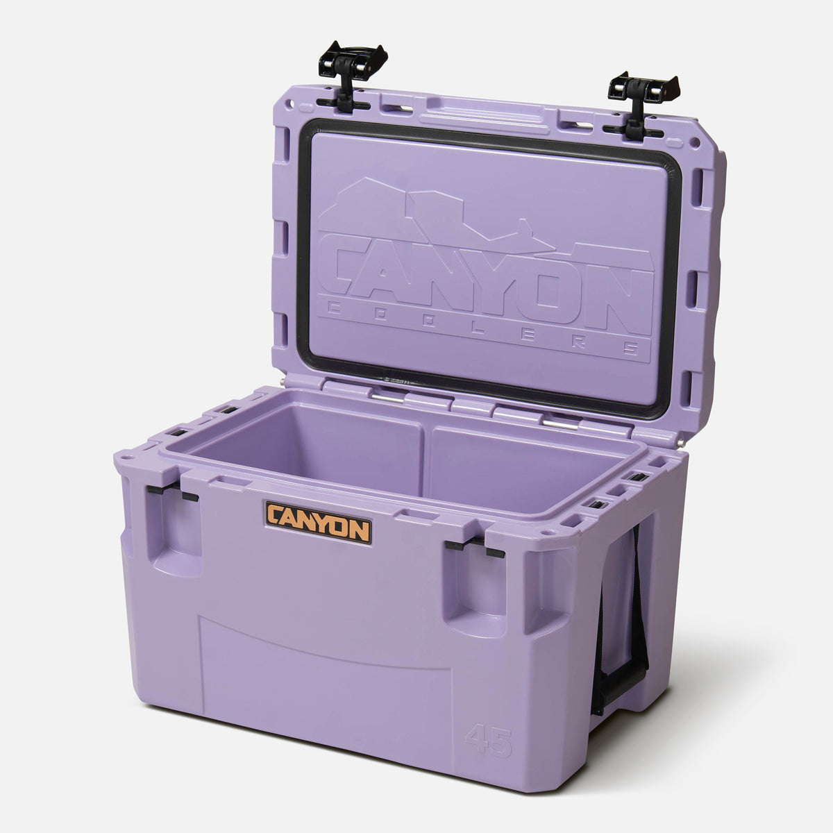 purple 45qt medium rotomolded hard cooler offset lid open with black large handle latches and the &#39;canyon&#39; brand logo on the front. one strap handle visible, divider table visible in divider slot