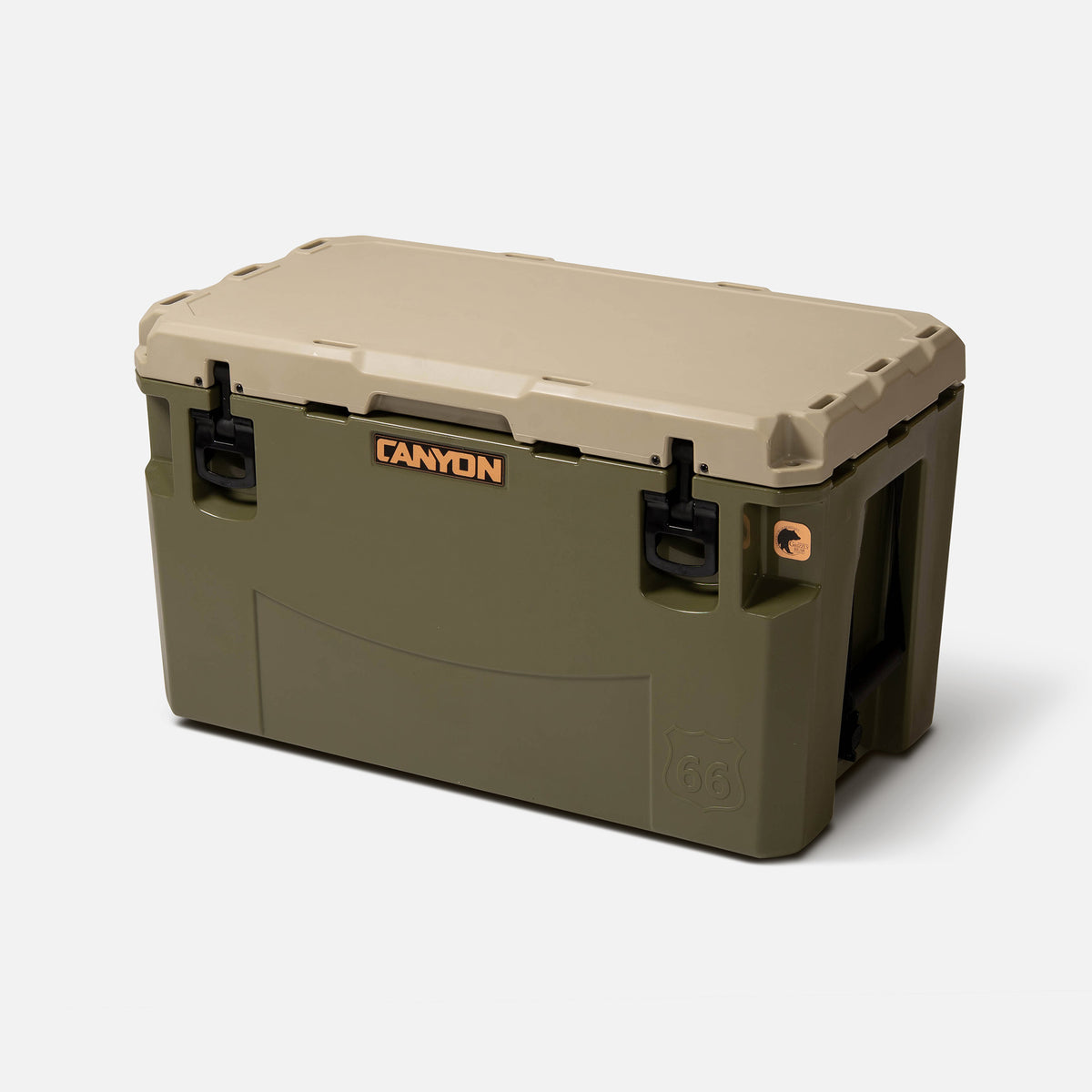 green with a tan lid 66qt large rotomolded hard cooler offset lid closed with large black latches and the &#39;canyon&#39; brand logo on the top front. strap handle on a white background