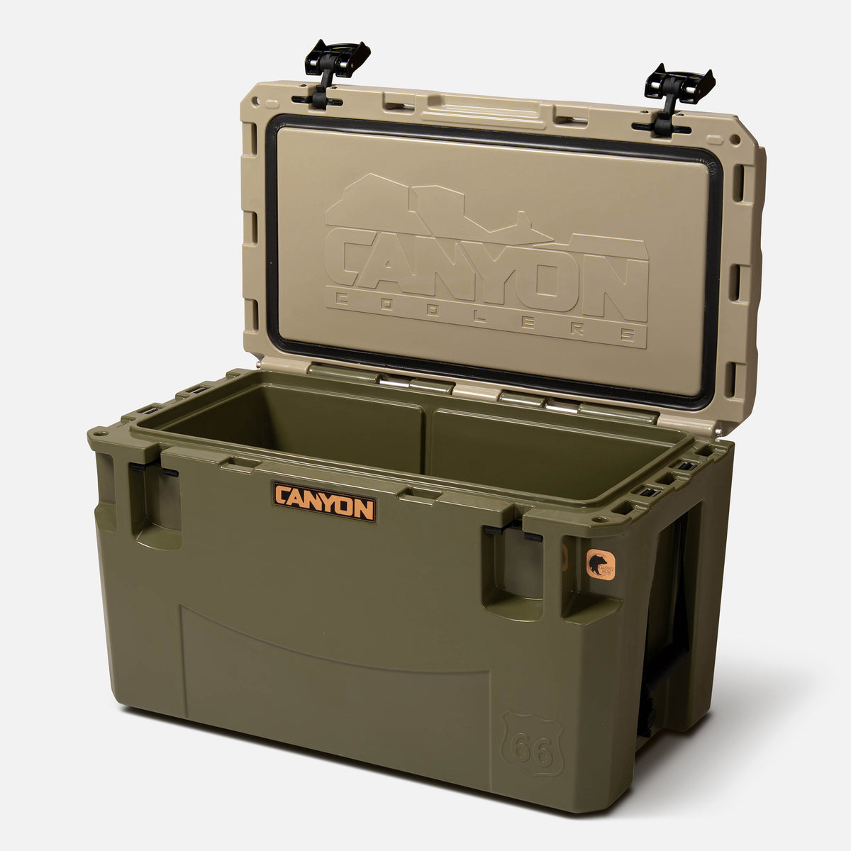 green with a tan lid
 66qt large rotomolded hard cooler offset lid open with black large handle latches and the &#39;canyon&#39; brand logo on the front. one strap handle visible, divider table visible in divider slot