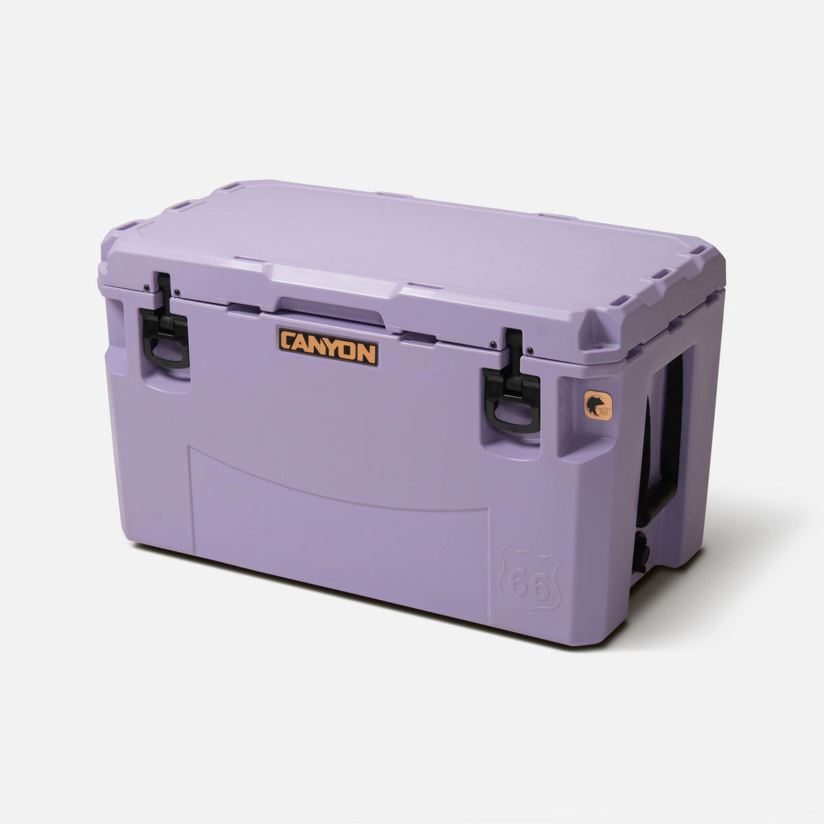 purple 66qt large rotomolded hard cooler offset lid closed with large black latches and the &#39;canyon&#39; brand logo on the top front. strap handle on a white background