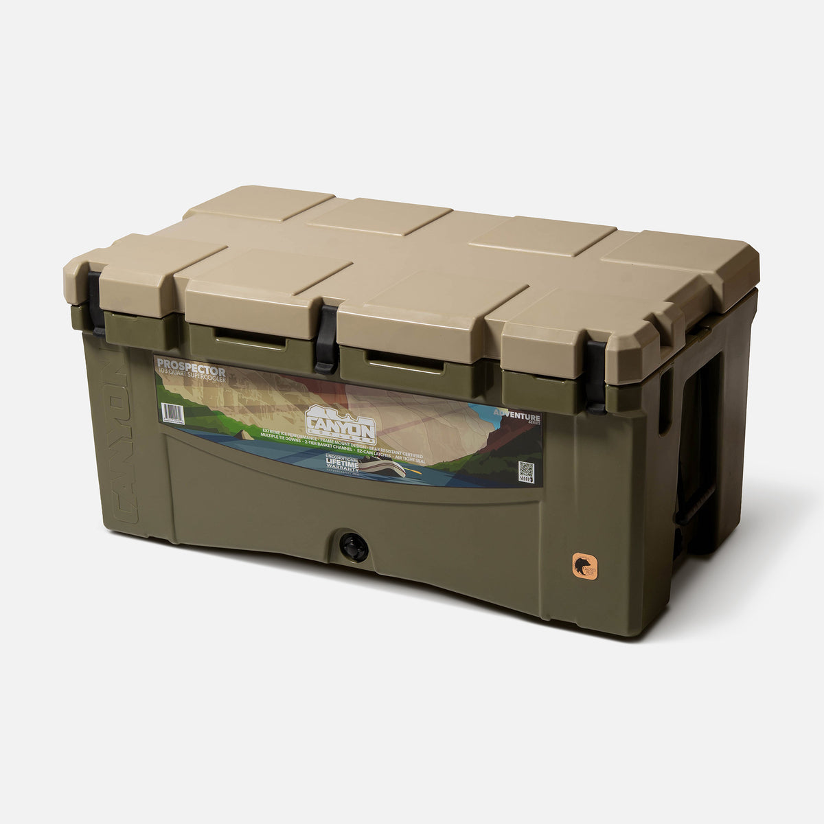 Green with a tan lid 103qt large rotomolded hard cooler offset lid closed with 3 black latches and the &#39;canyon&#39; brand logo on the top front. strap handle front drain plug