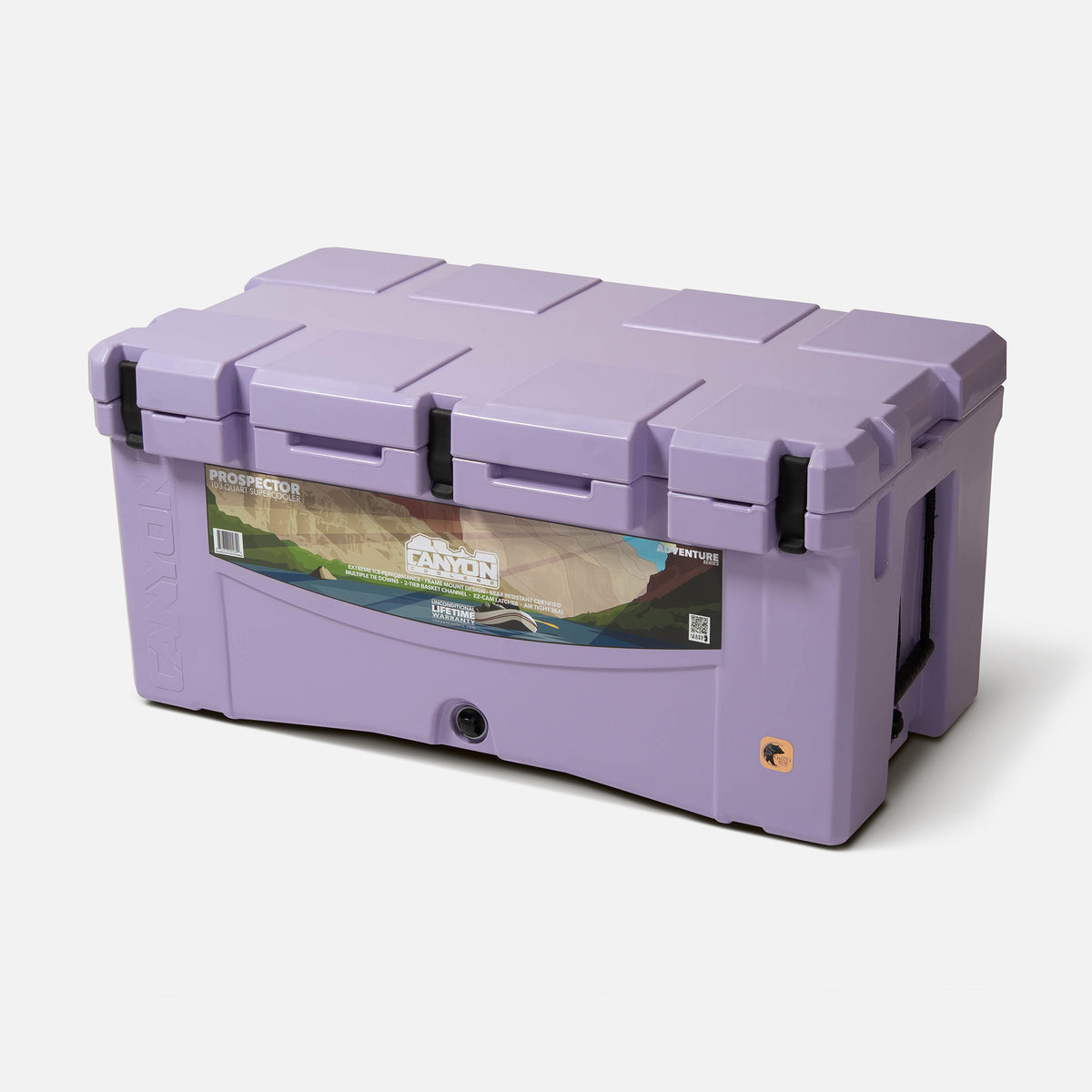 purple 103qt large rotomolded hard cooler offset lid closed with 3 black latches and the &#39;canyon&#39; brand logo on the top front. strap handle front drain plug