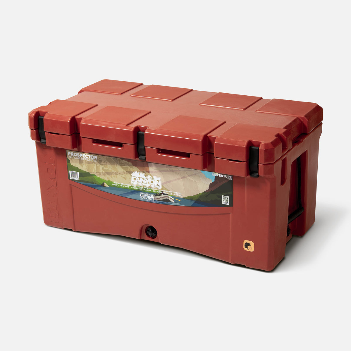 red 103qt large rotomolded hard cooler offset lid closed with 3 black latches and the &#39;canyon&#39; brand logo on the top front. strap handle front drain plug
