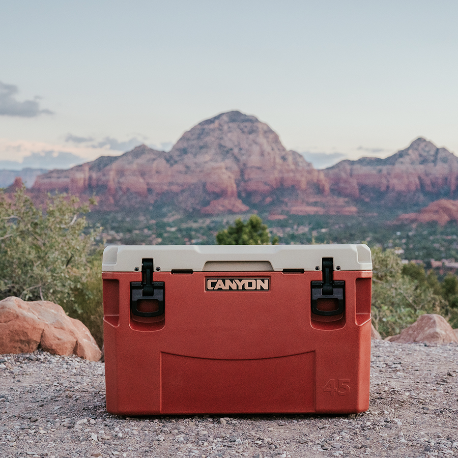 Red Canyon cooler with mountainous landscape in the background