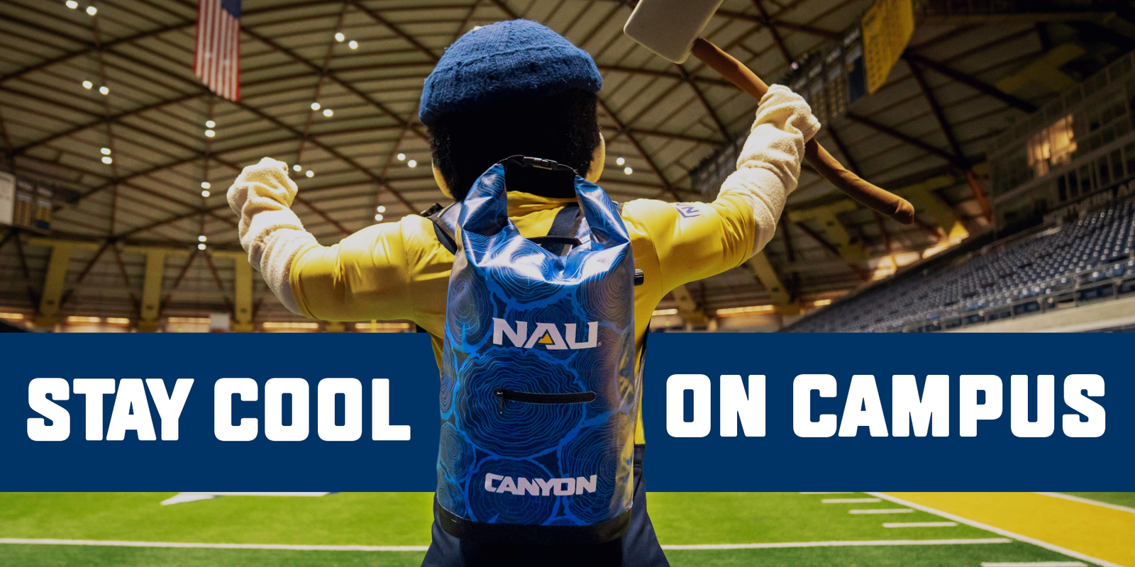Louie the Lumberjack wearing an NAU branded soft cooler in front of a banner that says "Stay Cool on Campus"