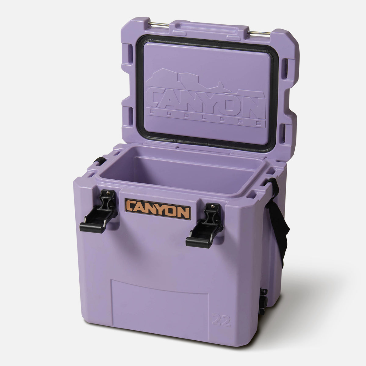 purple 22qt small  hard cooler box offset facing lid open with copper colored Canyon logo on a white background cam action latch soft web handle