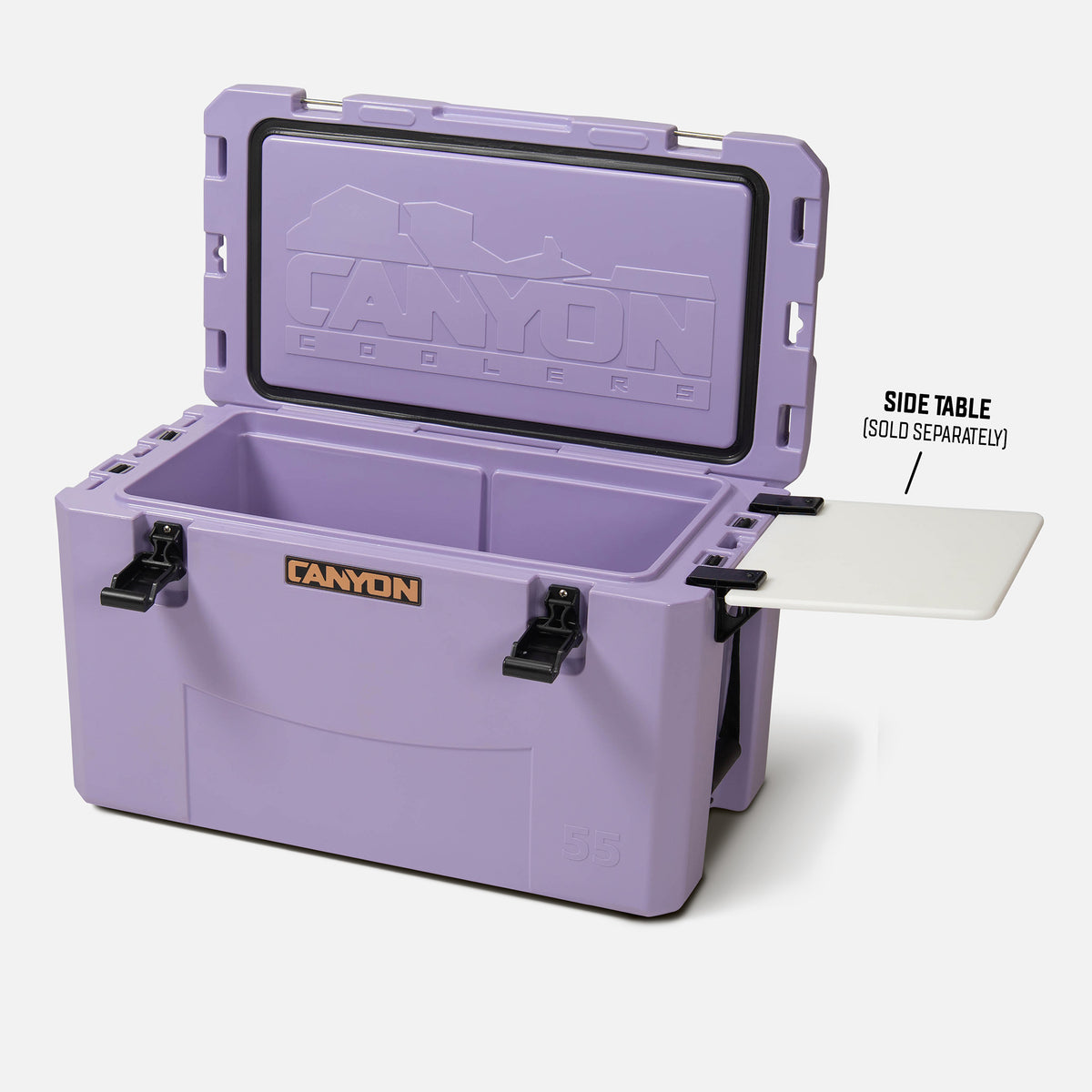purple 55qt medium rotomolded plastic hard cooler with the brand &#39;canyon&#39; logo on the front. It has black cam latches, a textured surface. offset and open on a white background divider slot visible optional side table divider shown